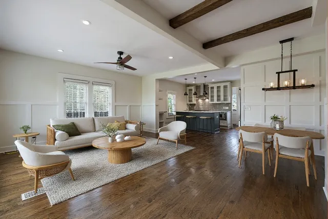 a view of a kitchen with a sink and a refrigerator