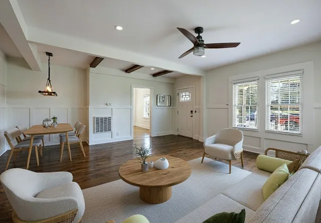 a kitchen with a sink a window and wooden floor