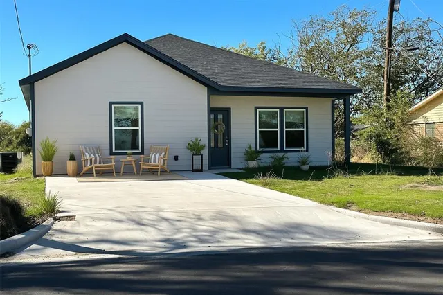 a house view with a garden space