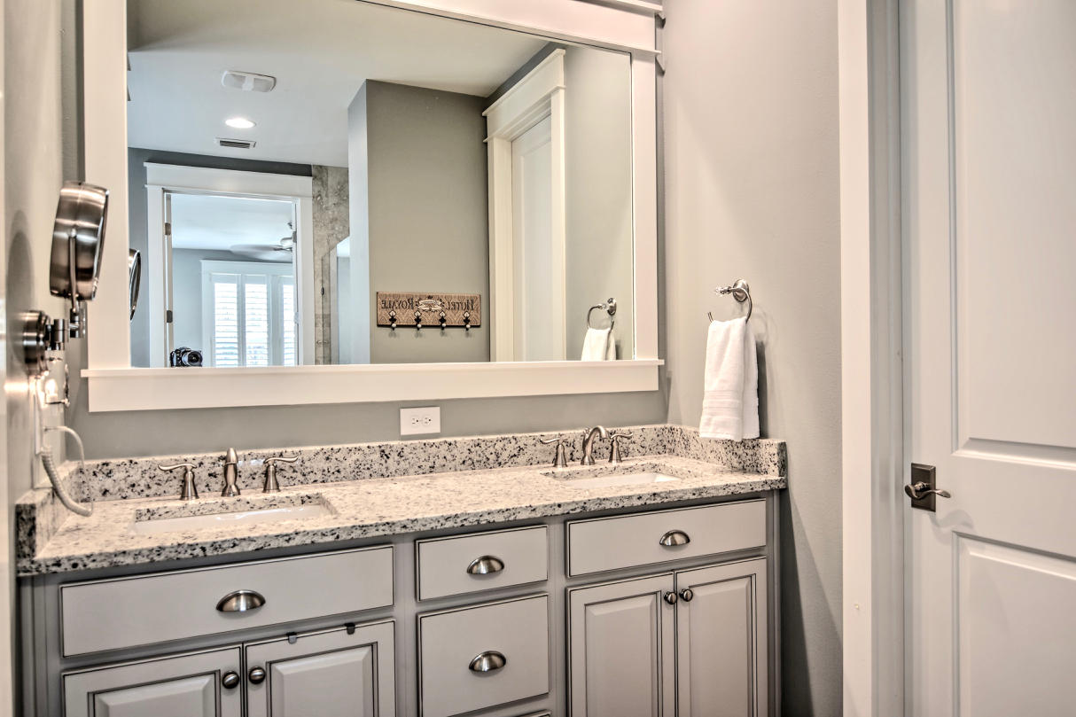 147 Jack Knife Drive Watersound, FL 32461 - Photo 13 of 42 a bathroom with a granite countertop sink and a mirror