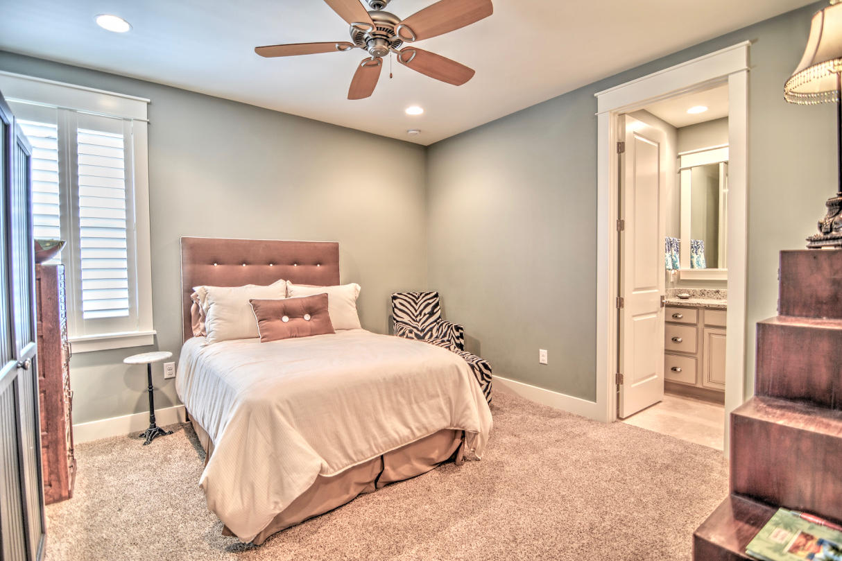 147 Jack Knife Drive Watersound, FL 32461 - Photo 14 of 42 a bedroom with a bed and a chandelier