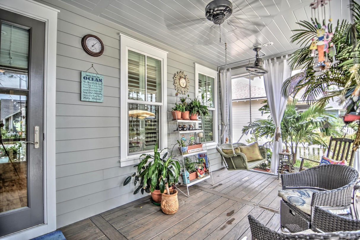147 Jack Knife Drive Watersound, FL 32461 - Photo 18 of 42 a view of a porch with furniture and wooden floor