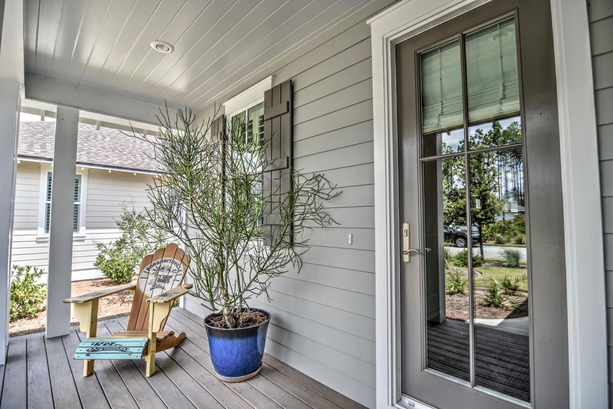 147 Jack Knife Drive Watersound, FL 32461 - Photo 2 of 42 a view of a door of the house with a potted plant and a glass door