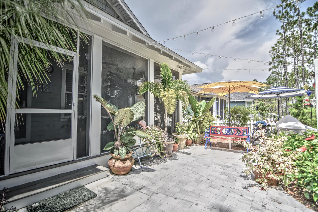 147 Jack Knife Drive Watersound, FL 32461 - Photo 21 of 42 a view of a chairs and table in patio with a barbeque