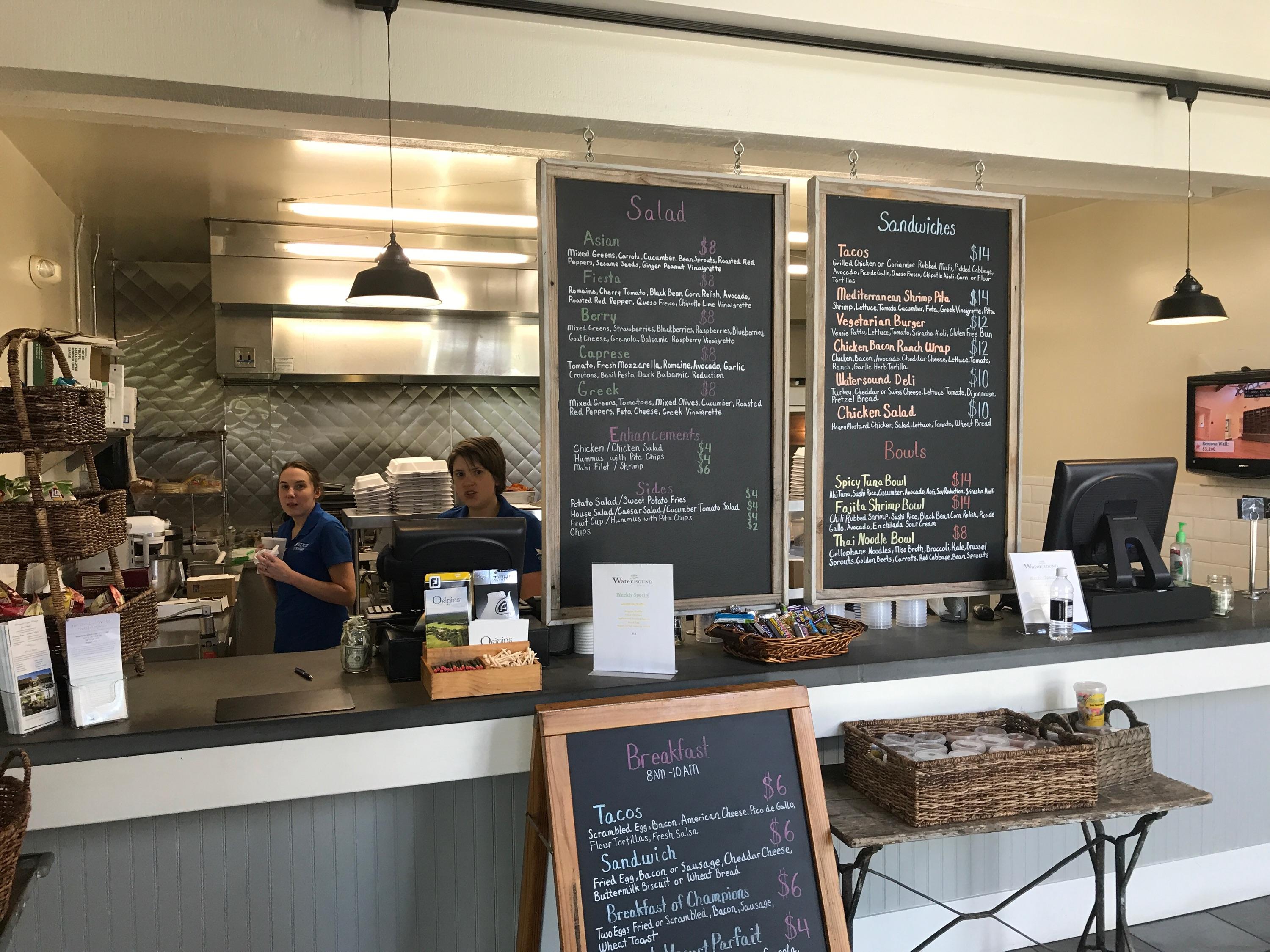 147 Jack Knife Drive Watersound, FL 32461 - Photo 41 of 42 a kitchen with a sink and a stove top oven
