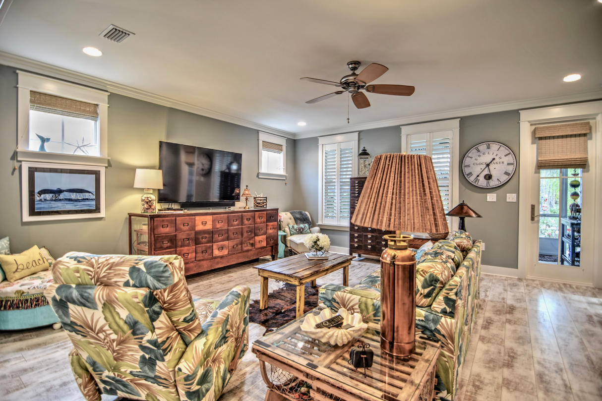 147 Jack Knife Drive Watersound, FL 32461 - Photo 8 of 42 a living room with furniture and a flat screen tv