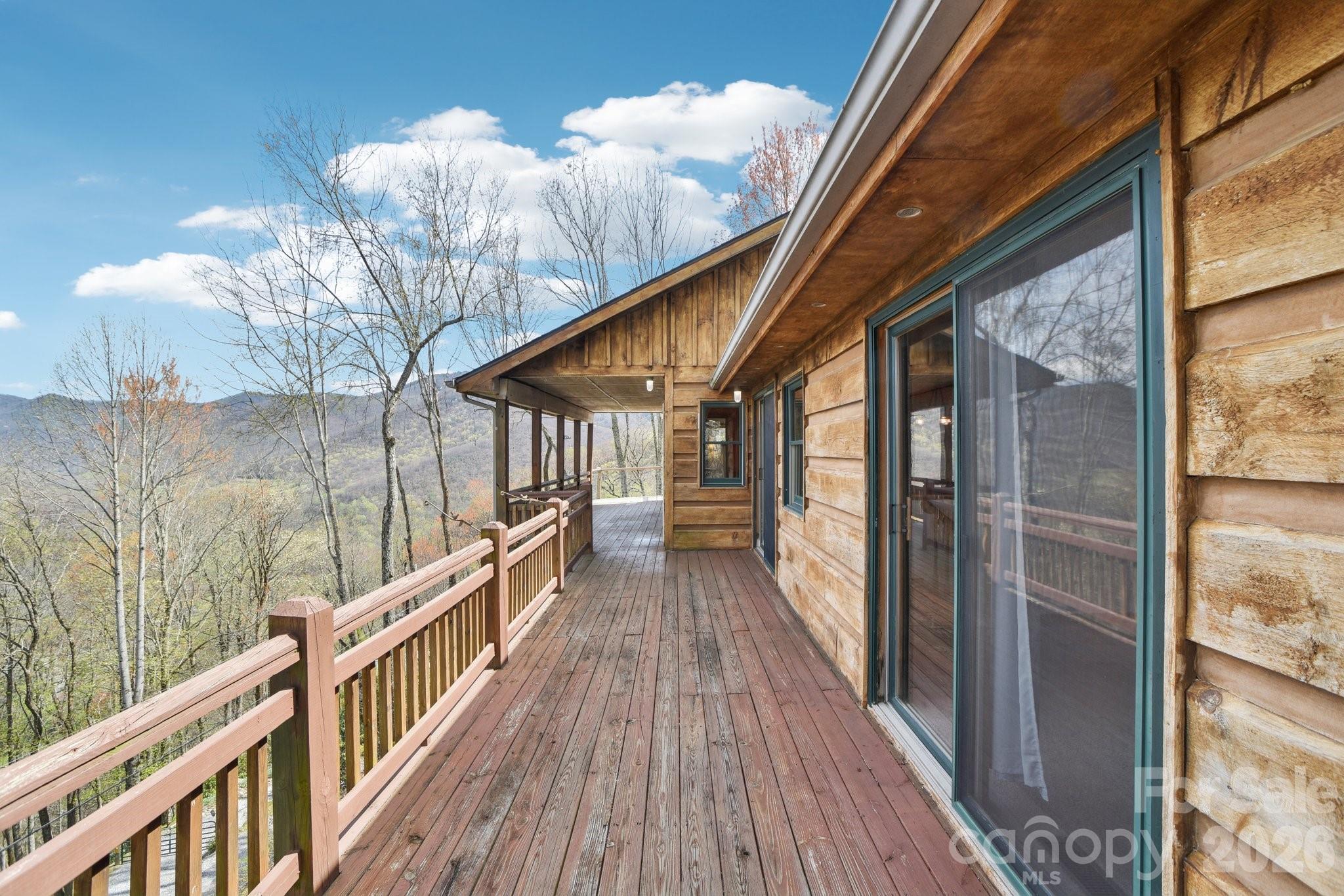 a view of balcony with wooden floor