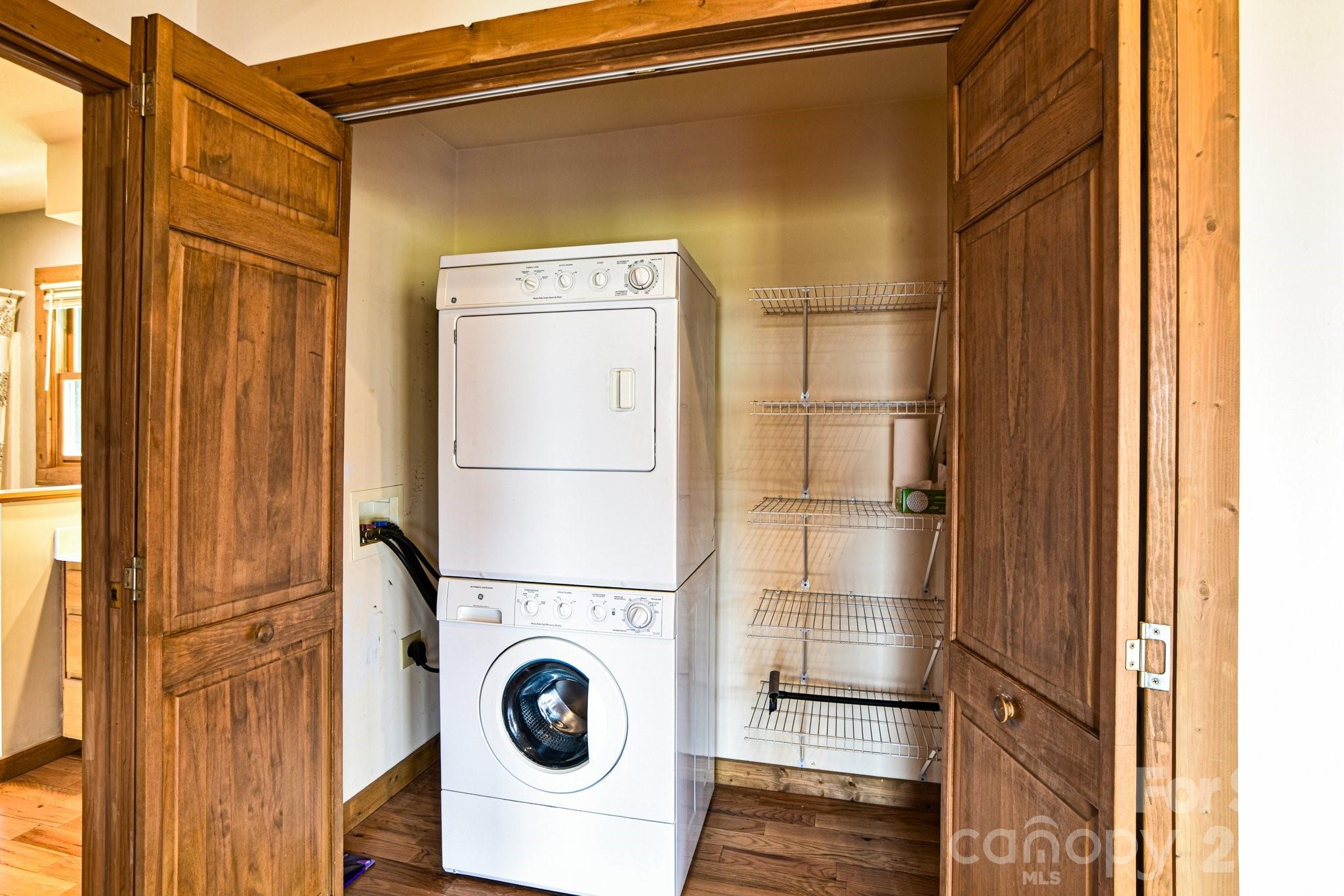 1426 Setzercove Road Maggie Valley, NC 28751 - Photo 15 of 48 a utility room with dryer and washer