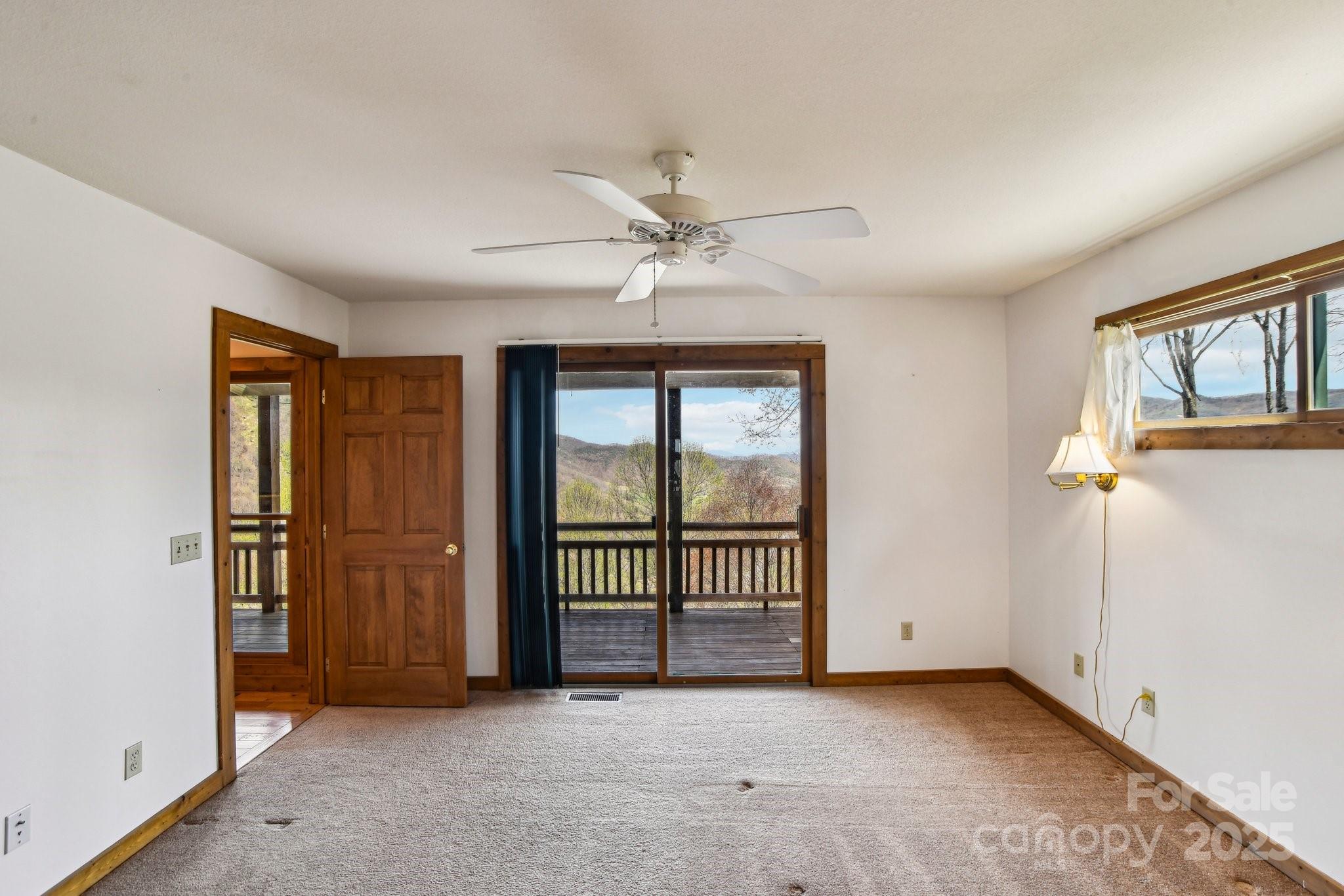 1426 Setzercove Road Maggie Valley, NC 28751 - Photo 19 of 48 an empty room with windows
