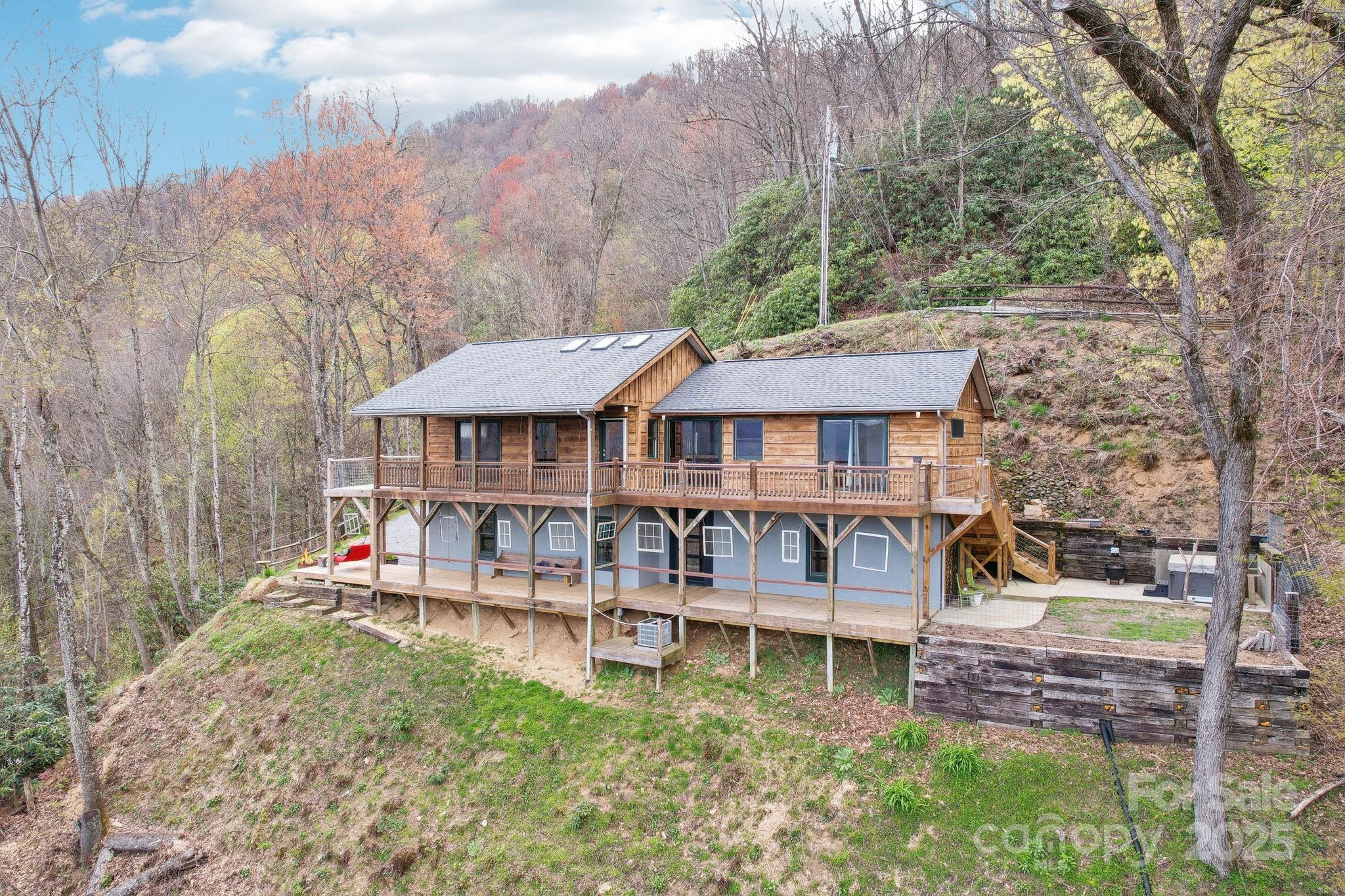1426 Setzercove Road Maggie Valley, NC 28751 - Photo 3 of 48 aerial view of a house with a yard