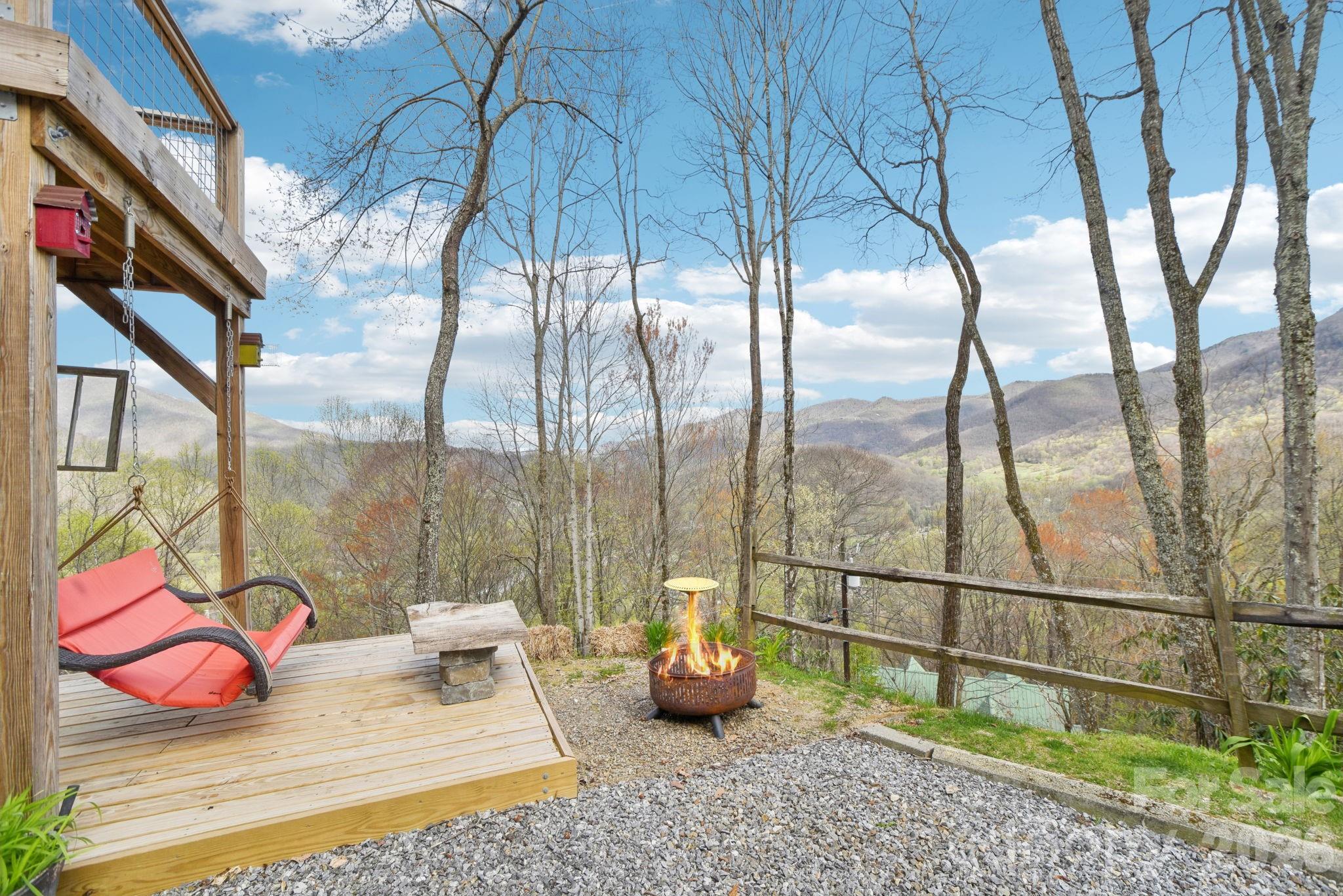 1426 Setzercove Road Maggie Valley, NC 28751 - Photo 33 of 48 a bedroom with furniture and a window