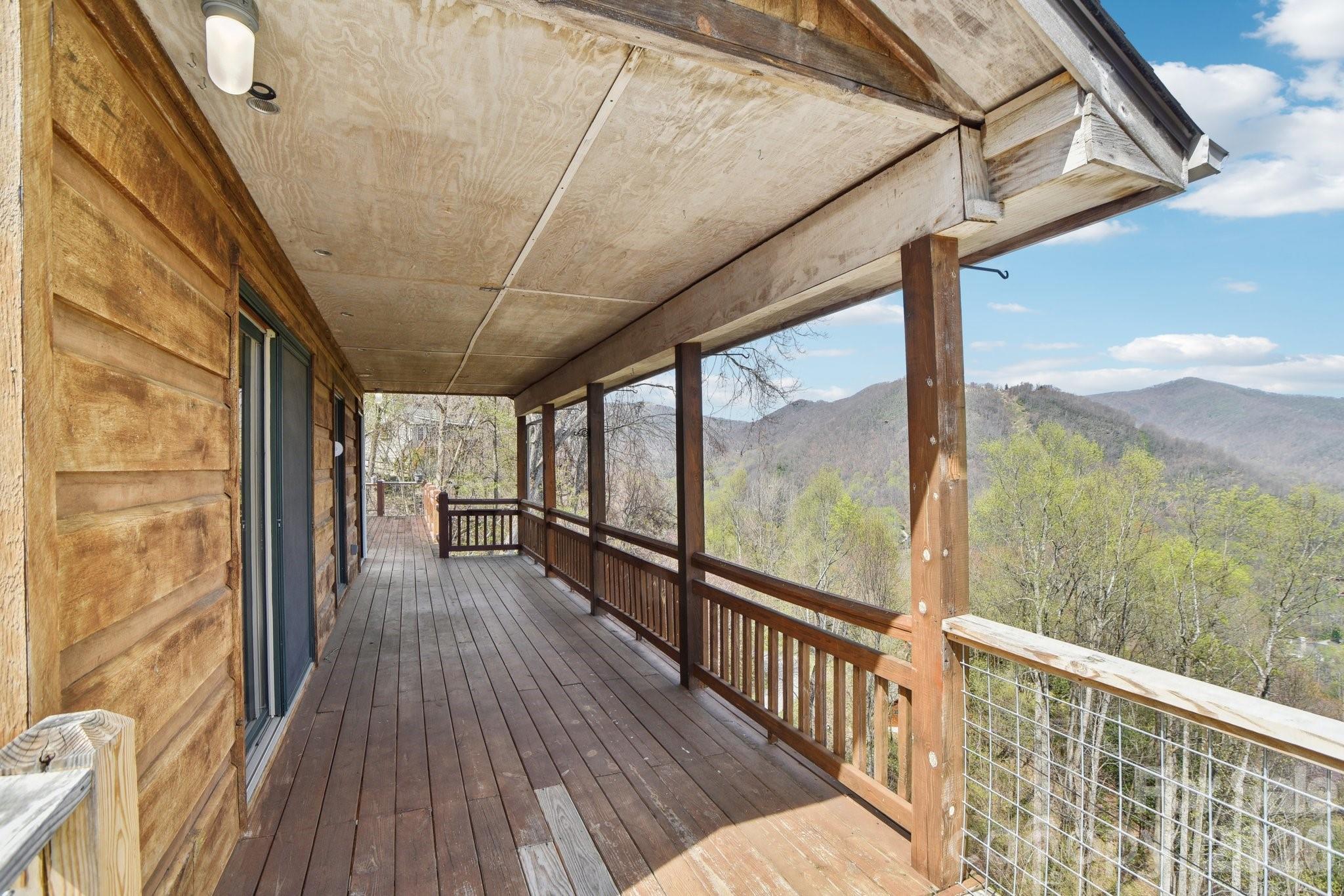 1426 Setzercove Road Maggie Valley, NC 28751 - Photo 38 of 48 a view of a balcony with wooden floor