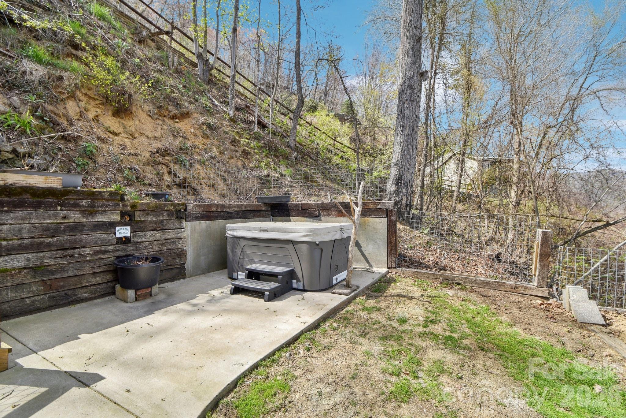 1426 Setzercove Road Maggie Valley, NC 28751 - Photo 40 of 48 a view of a backyard with sitting area