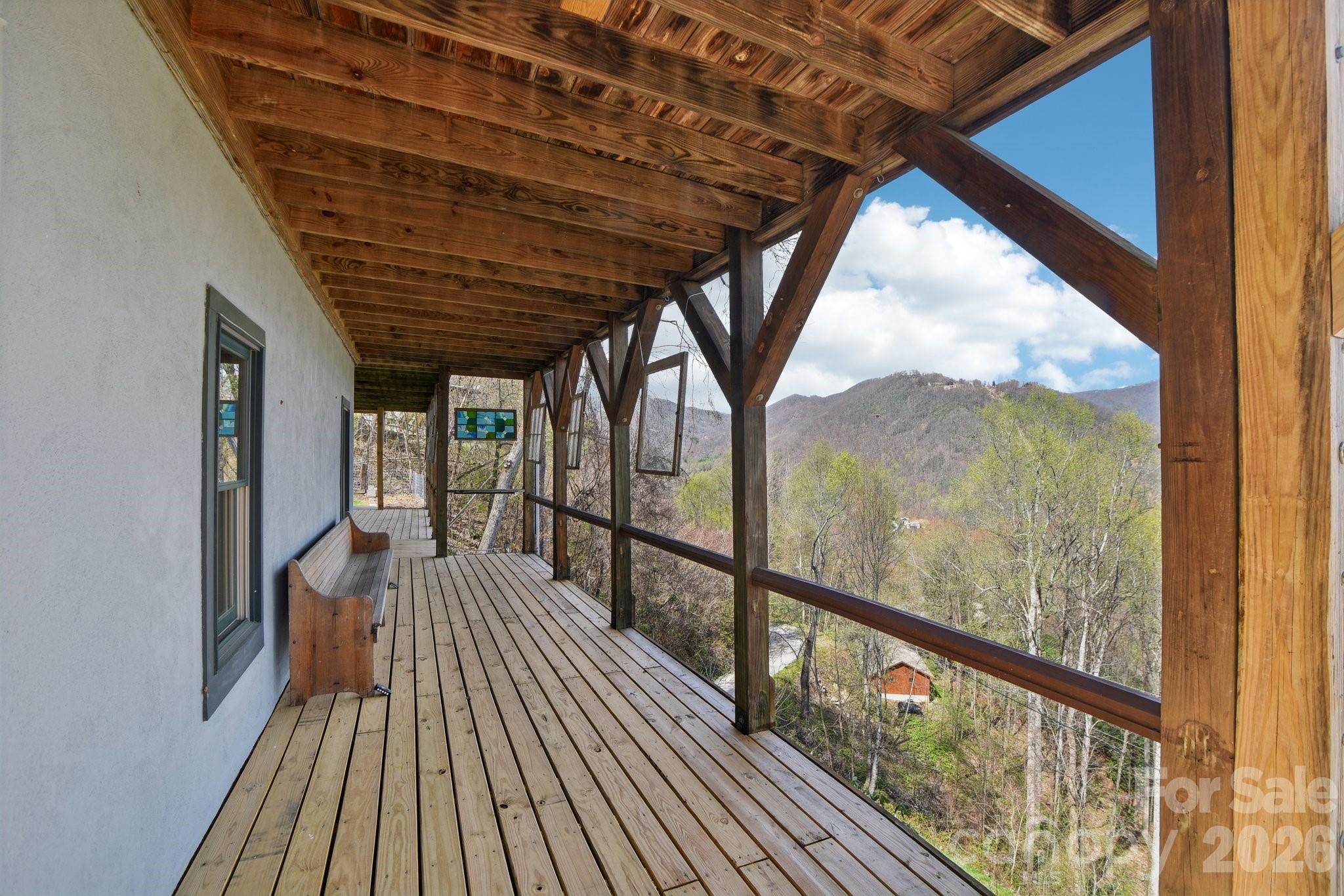 1426 Setzercove Road Maggie Valley, NC 28751 - Photo 7 of 48 a view of balcony with wooden floor