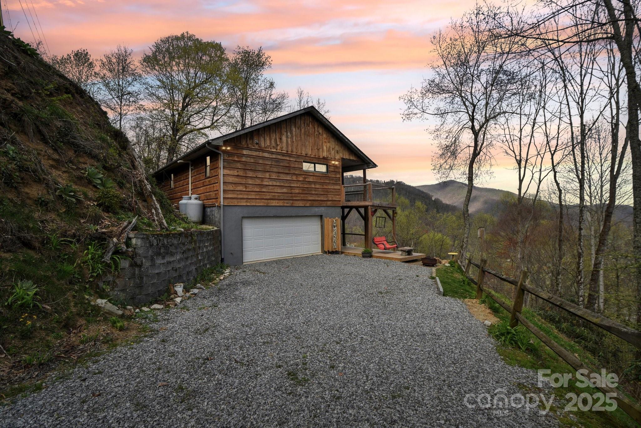 1426 Setzercove Road Maggie Valley, NC 28751 - Photo 7 of 48 a view of a house with a yard