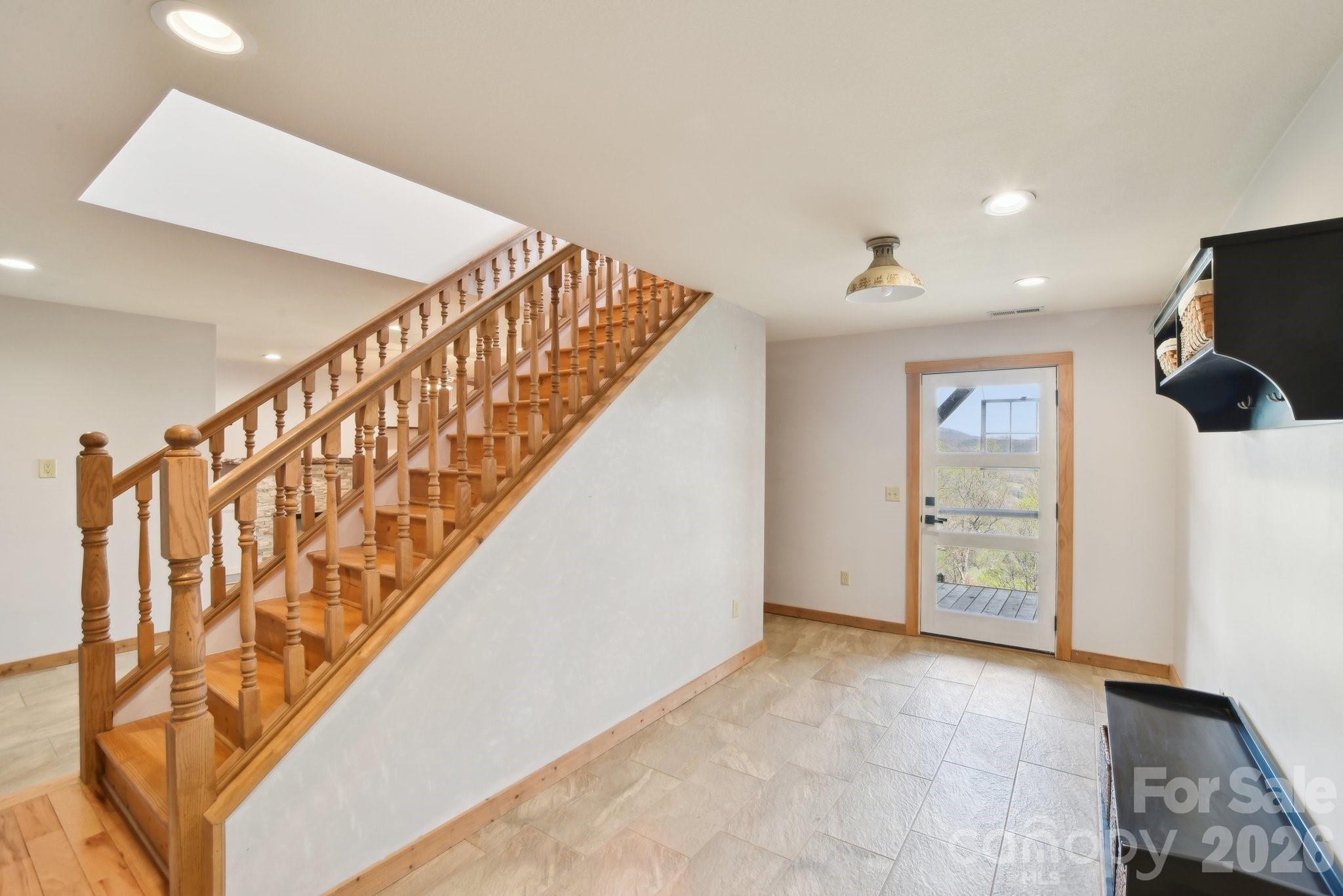 1426 Setzercove Road Maggie Valley, NC 28751 - Photo 9 of 48 a view of an entryway with wooden floor
