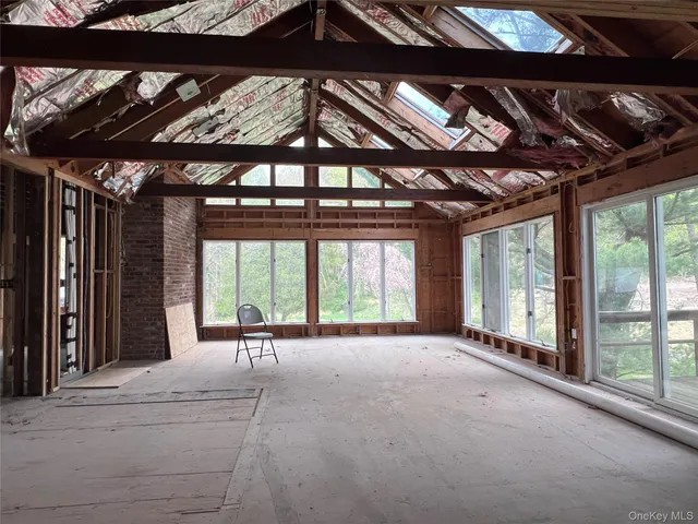 a view of an empty room with a balcony