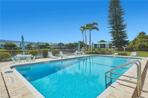 a view of a swimming pool with a lounge chairs