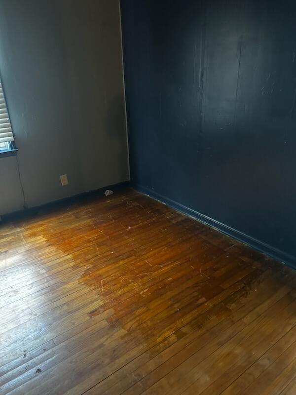 286 Tompkins Street Gary, IN 46406 - Photo 7 of 9 a view of an empty room and wooden floor