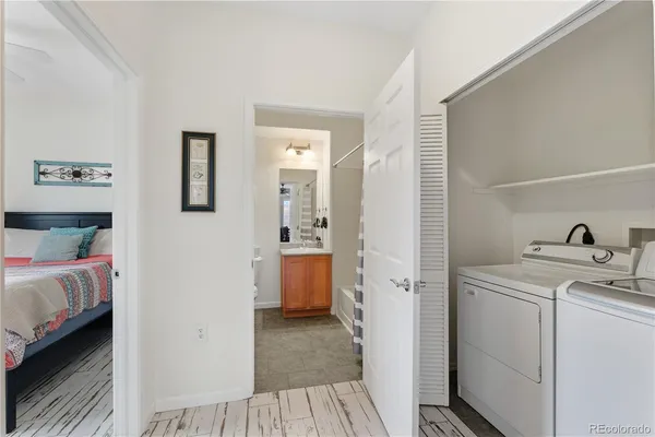 a view of a bedroom with a bed and a view of bedroom