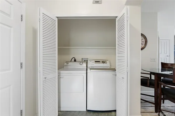 a bedroom with bed and wooden floor