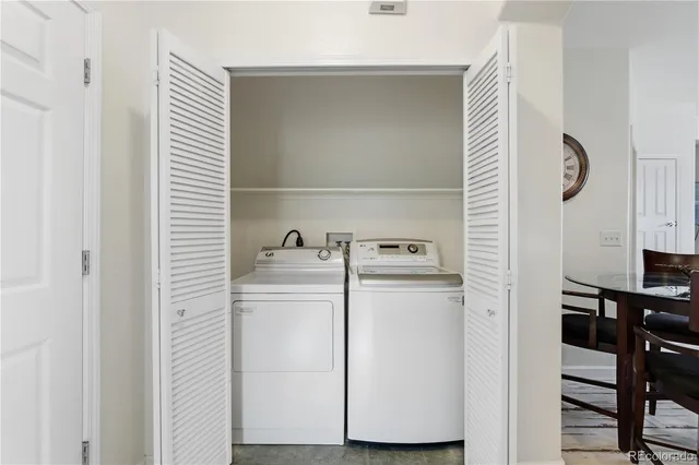 a bedroom with bed and wooden floor