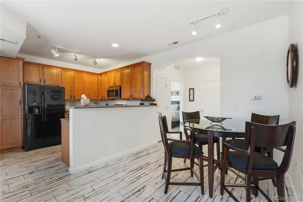 a view of a dining room with furniture and wooden floor
