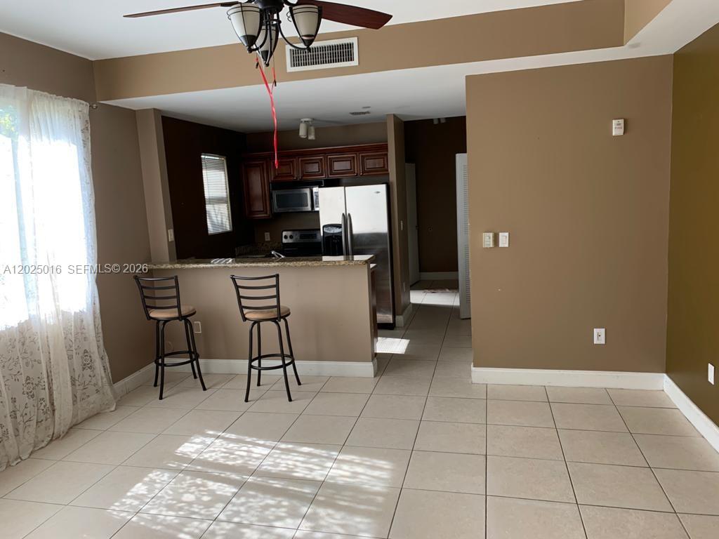 400 Southwest 2nd Street, Unit 201 Miami, FL 33130 - Photo 2 of 12 a view of a livingroom with furniture and window