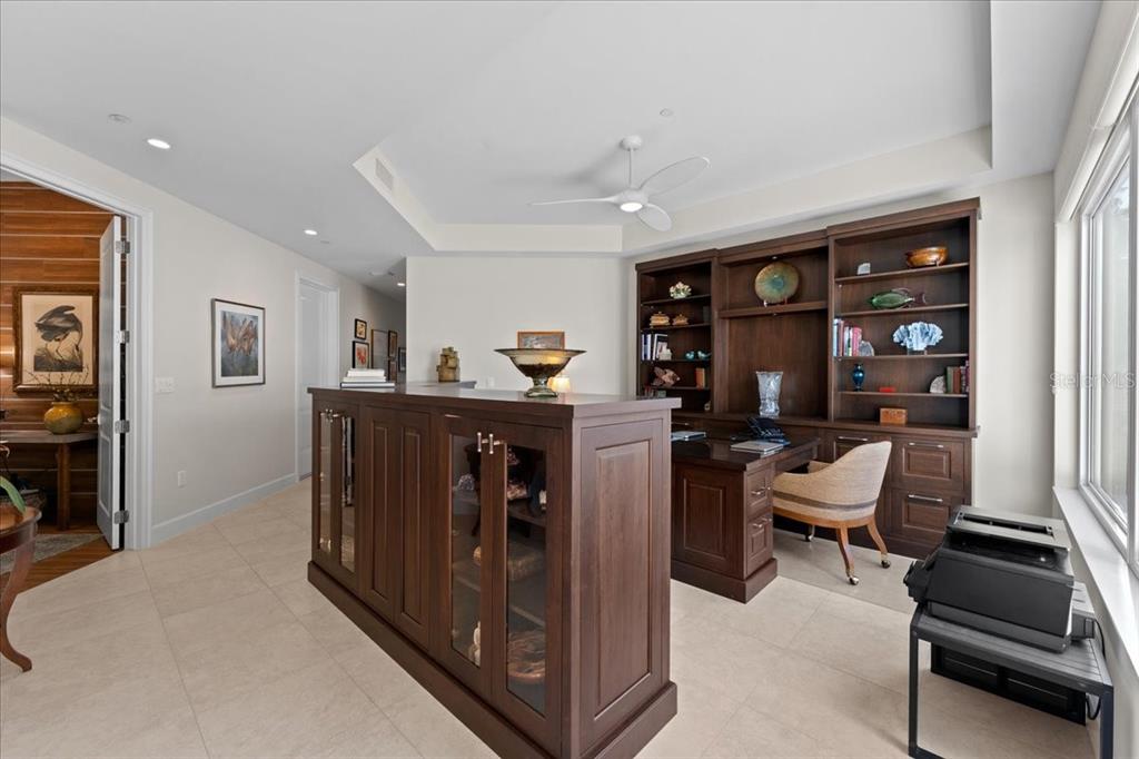 2708 North Beach Road, Unit 2 Englewood, FL 34223 - Photo 12 of 65 a view of a workspace with furniture and a window