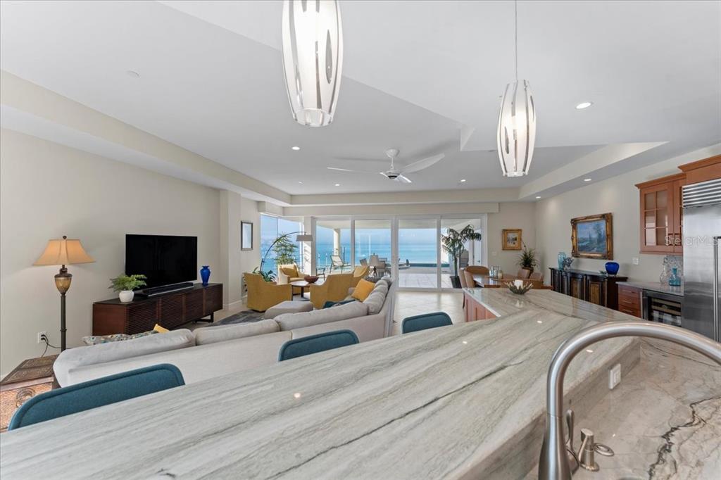 2708 North Beach Road, Unit 2 Englewood, FL 34223 - Photo 15 of 65 a large living room with furniture and a flat screen tv