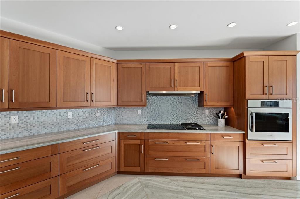 2708 North Beach Road, Unit 2 Englewood, FL 34223 - Photo 17 of 65 a kitchen with granite countertop cabinets and window