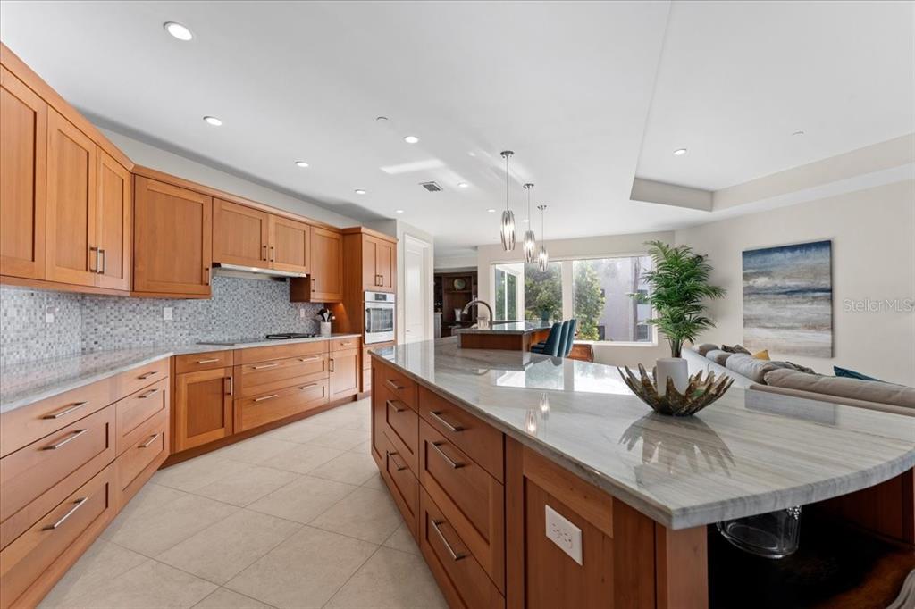 2708 North Beach Road, Unit 2 Englewood, FL 34223 - Photo 20 of 65 a kitchen with stainless steel appliances granite countertop a sink and cabinets