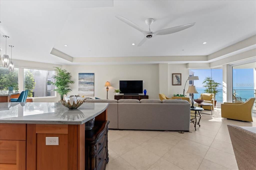 2708 North Beach Road, Unit 2 Englewood, FL 34223 - Photo 22 of 65 a living room with furniture and a flat screen tv