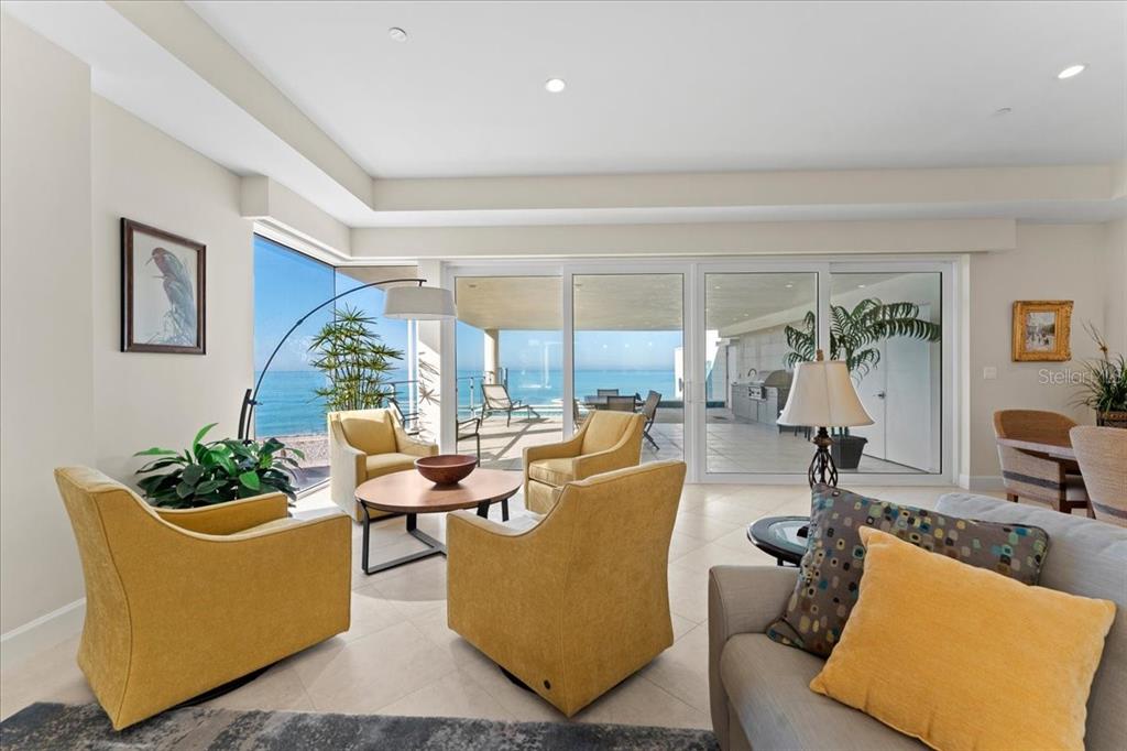 2708 North Beach Road, Unit 2 Englewood, FL 34223 - Photo 25 of 65 a living room with furniture and a large window