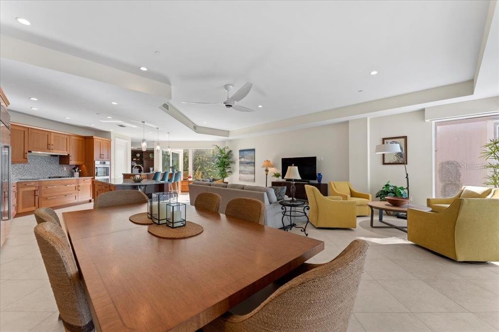 2708 North Beach Road, Unit 2 Englewood, FL 34223 - Photo 28 of 65 a living room with furniture kitchen view and a large window