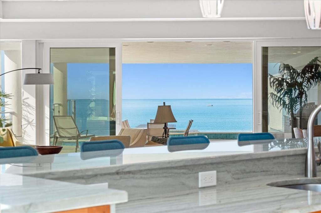 2708 North Beach Road, Unit 2 Englewood, FL 34223 - Photo 30 of 65 a living room with furniture and a potted plant