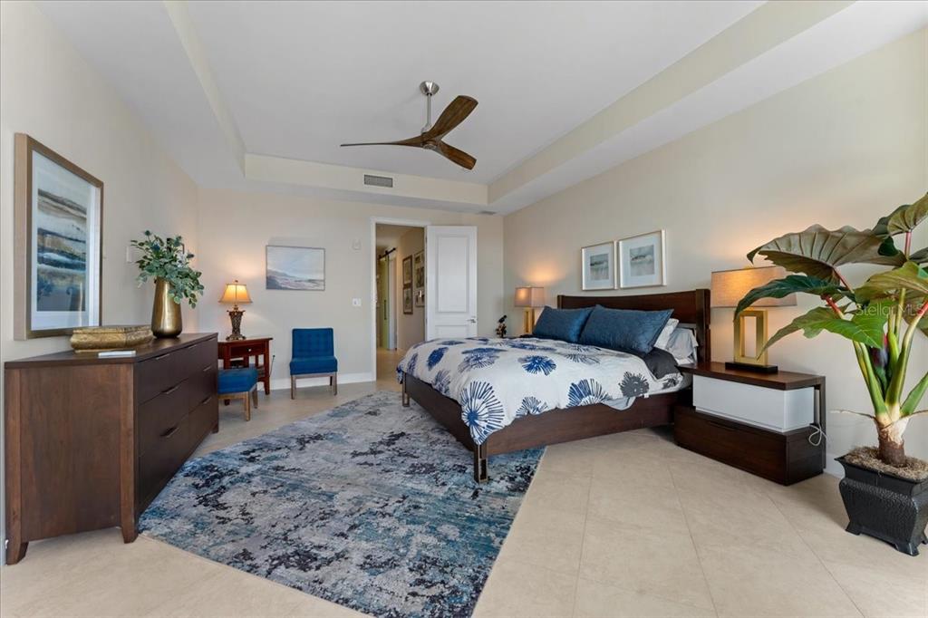 2708 North Beach Road, Unit 2 Englewood, FL 34223 - Photo 33 of 65 a bedroom with a bed a couch and dresser