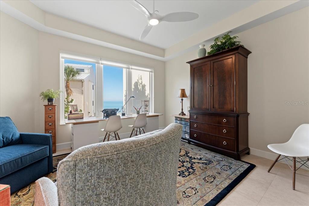 2708 North Beach Road, Unit 2 Englewood, FL 34223 - Photo 46 of 65 a living room with furniture and a rug