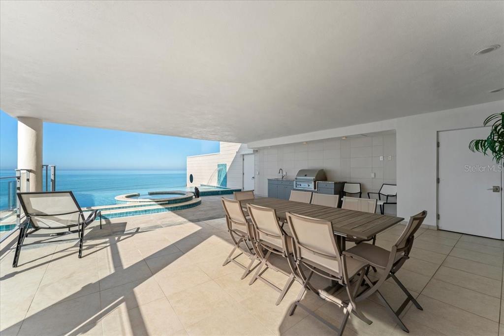 2708 North Beach Road, Unit 2 Englewood, FL 34223 - Photo 58 of 65 a view of a dining room with furniture and a table