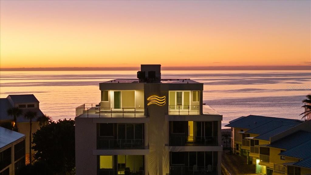 2708 North Beach Road, Unit 2 Englewood, FL 34223 - Photo 65 of 65 a front view of a building with glass windows