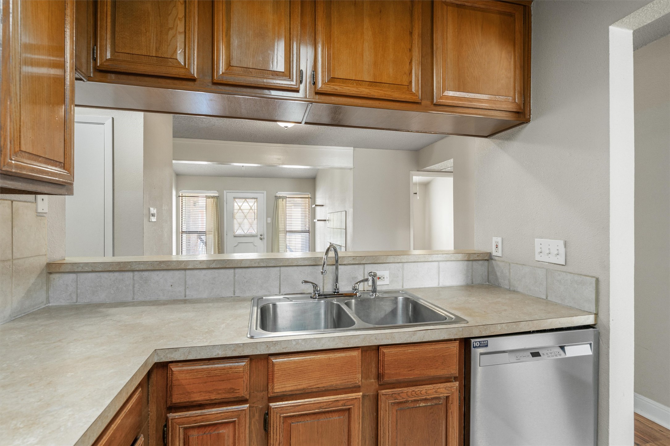 806 West 24th Street, Unit 326 Austin, TX 78705 - Photo 12 of 33 a kitchen with stainless steel appliances granite countertop a sink and cabinets