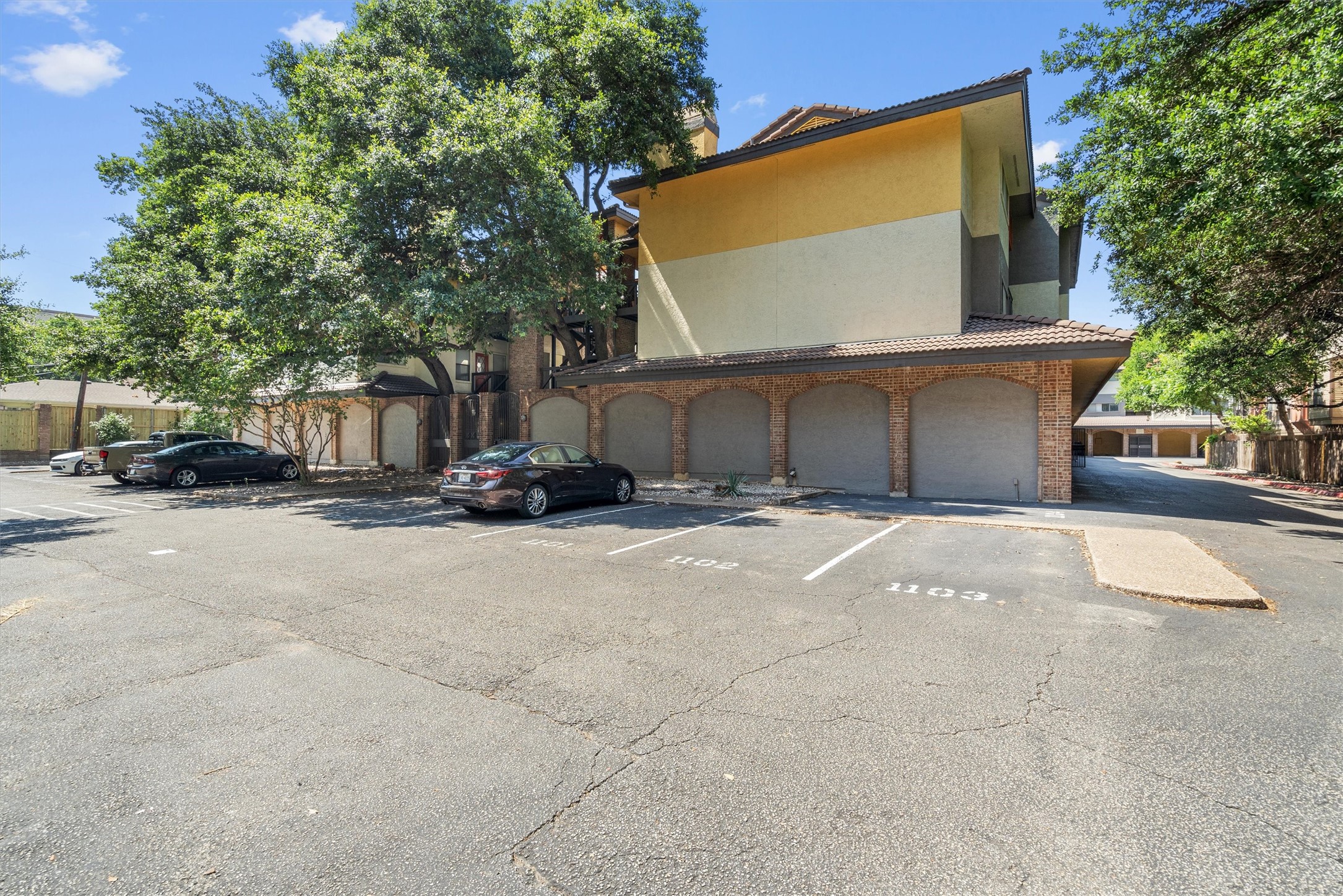 806 West 24th Street, Unit 326 Austin, TX 78705 - Photo 28 of 33 a view of a house with a yard and parking space