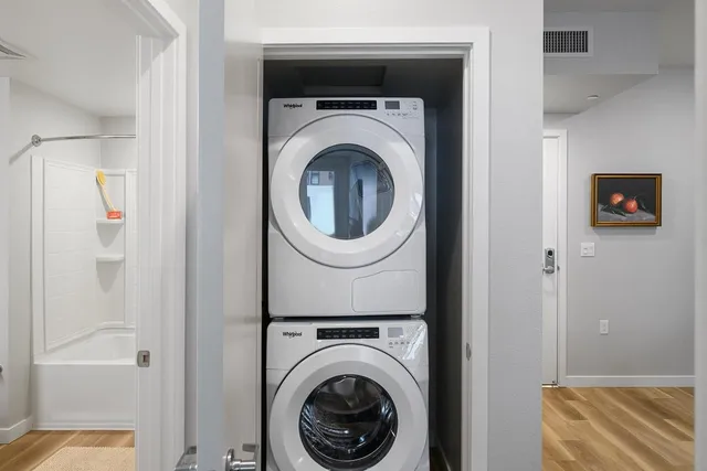 a view of a hallway with washer and dryer