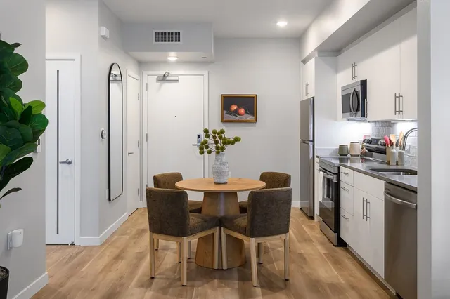 a dining room with furniture and window