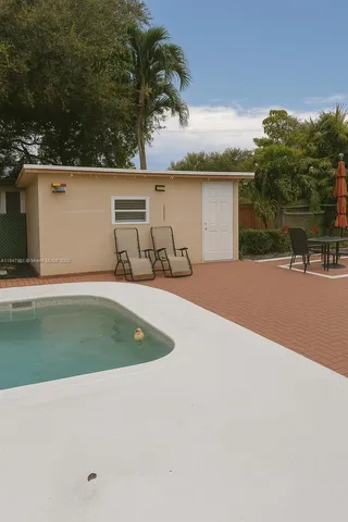 a view of a swimming pool with an outdoor space