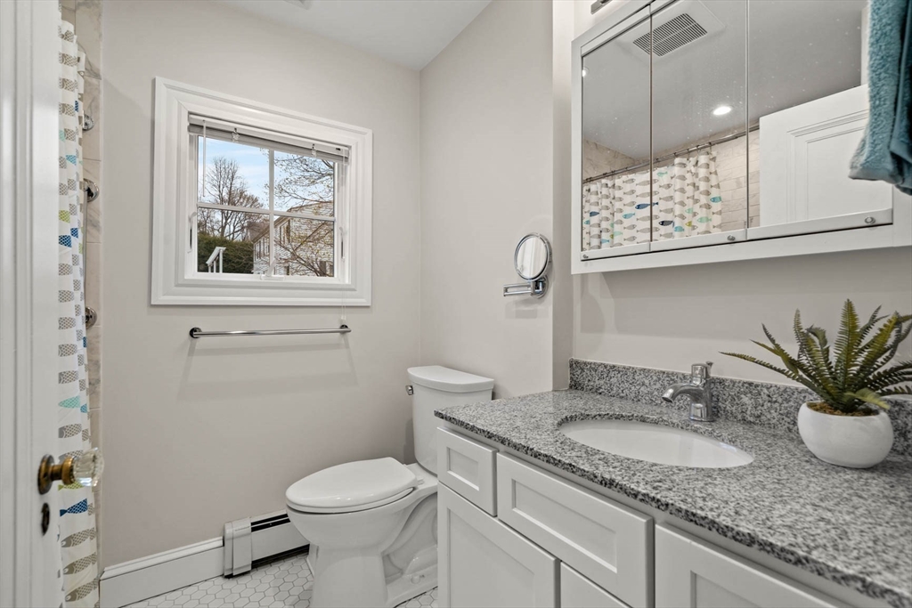 50 Allen Road Winchester, MA 01890 - Photo 18 of 29 a bathroom with a granite countertop sink mirror vanity and toilet