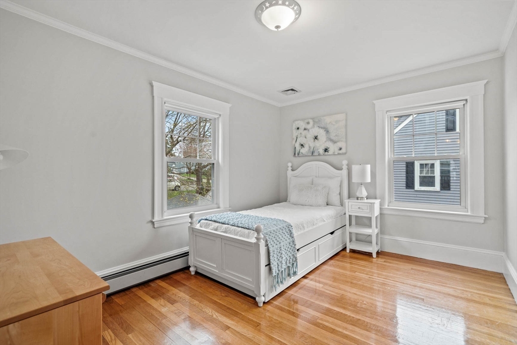 50 Allen Road Winchester, MA 01890 - Photo 19 of 29 a living room with a bed furniture and a window