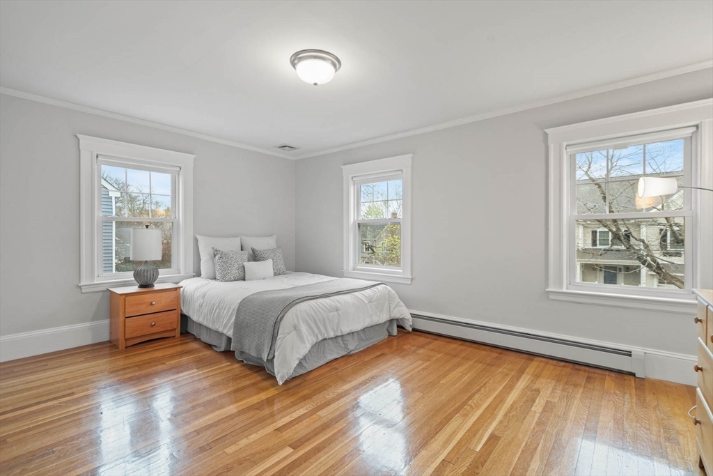 50 Allen Road Winchester, MA 01890 - Photo 20 of 29 a bedroom with a bed and a large window