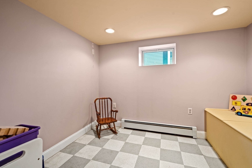 50 Allen Road Winchester, MA 01890 - Photo 23 of 29 a view of a room with a piano and wooden floor