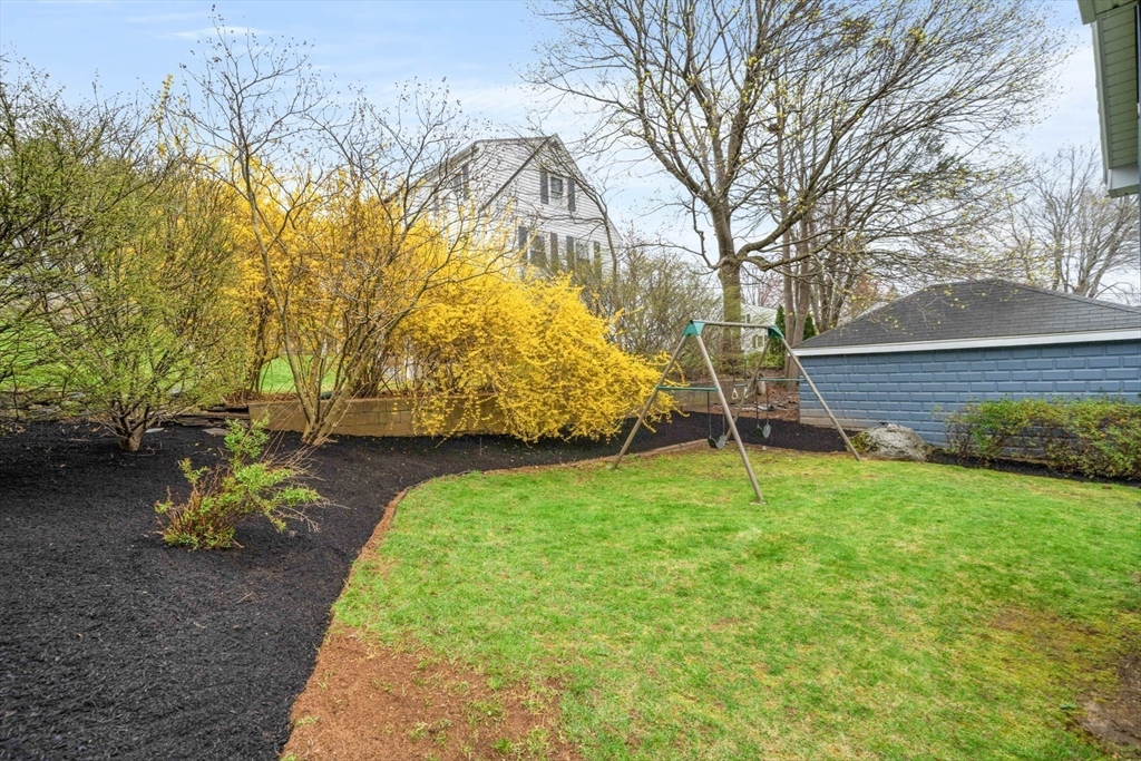 50 Allen Road Winchester, MA 01890 - Photo 24 of 29 a backyard of a house with table and chairs